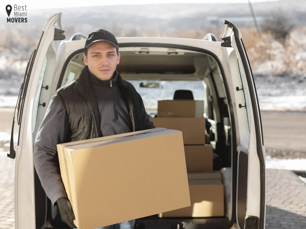 Team Member Unloading Boxes Best Miami Movers Winter Relocation Team Member Boxes