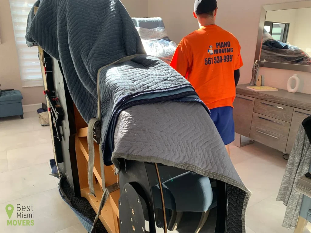 Piano Moving Team Member Prepared Instrument for Relocation Ready to Move