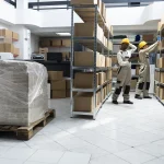 September Climate-Control Storage Service Team Members Prepare Place for Customer Boxes
