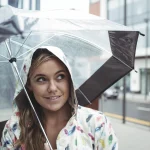 September Peak Hurricane Season Relocation Customer Hide Under Umbrella During Rain